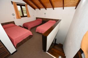 Postel nebo postele na pokoji v ubytování Cabañas Los Moye