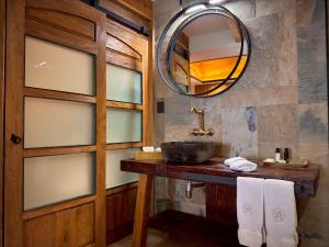 a bathroom with a sink and a mirror at Hotel Boutique Casa Laja in San Miguel de Allende +105 photos