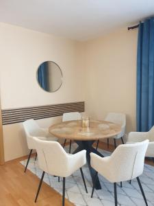 a dining room with a table and chairs at Apartman Triangel 1-04 in Donovaly