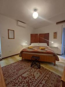Ένα ή περισσότερα κρεβάτια σε δωμάτιο στο Casa Il Muro