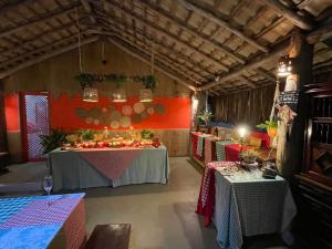 a room with two tables and two tables sidx sidx sidx at Pousada Nascer do Sol in Marau