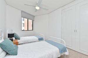 Ένα ή περισσότερα κρεβάτια σε δωμάτιο στο Triview Mitchell Street Unit 4 1 Soldiers Point