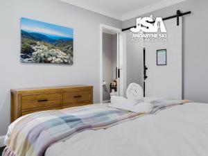 Ένα ή περισσότερα κρεβάτια σε δωμάτιο στο Edelweiss Cottage