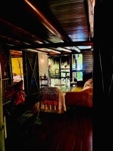 a bedroom with a bed in a room at Pousada Magia da Mata in Trindade