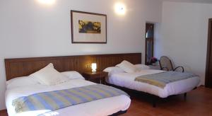 A bed or beds in a room at El Sequer Casa Rural