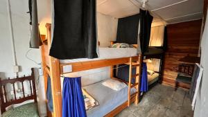 Llit o llits en una habitació de Parcerito's Hostel