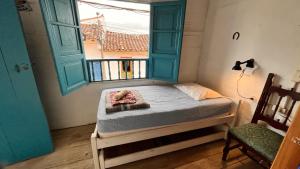 Postel nebo postele na pokoji v ubytování Parcerito's Hostel