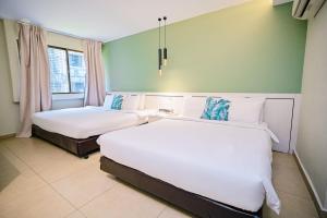 Postel nebo postele na pokoji v ubytování Kingston Hotel 1 - Bukit Bintang