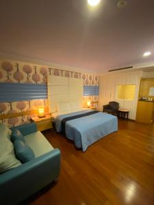 Postel nebo postele na pokoji v ubytování Dong Zhi Gang Motel