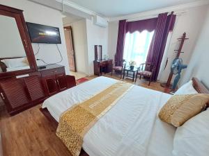 Postel nebo postele na pokoji v ubytování Indochina Airport Hotel Ha Noi