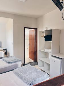 Cama ou camas em um quarto em Pousada Serra de São Thomé