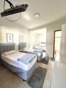 Cama ou camas em um quarto em Pousada Serra de São Thomé