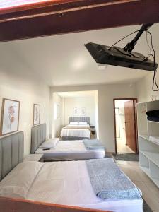 Cama ou camas em um quarto em Pousada Serra de São Thomé