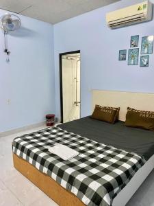 Postel nebo postele na pokoji v ubytování Nhà nghỉ Đoàn Gia