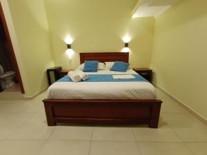 Voodi või voodid majutusasutuse Hostal CañaLimeña toas