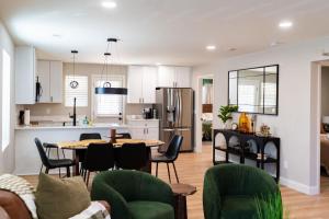 a kitchen and living room with a table and chairs at Family Style Home in South Knoxville in Knoxville