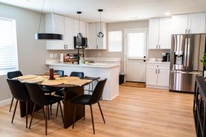 a kitchen and dining room with a table and chairs at Family Style Home in South Knoxville in Knoxville +19 photos