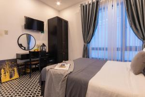 Postel nebo postele na pokoji v ubytování Tân Villa 2 Đà Lạt