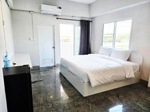 Postel nebo postele na pokoji v ubytování PKK hotel Residence