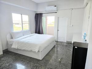 Postel nebo postele na pokoji v ubytování PKK hotel Residence