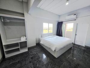 Postel nebo postele na pokoji v ubytování PKK hotel Residence