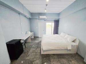 Postel nebo postele na pokoji v ubytování PKK hotel Residence