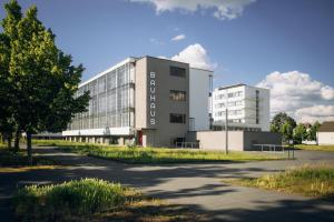a building with a road in front of it at Luxus Apartment am Bauhausmuseum in Dessau
