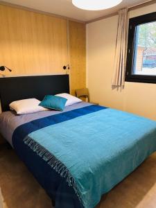 Postel nebo postele na pokoji v ubytování Le chalet de la Presquile