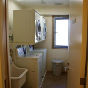 a bathroom with a sink and a toilet and a window at Ryugasaki Plaza Hotel Shinkan in Ryūgasaki +42 photos
