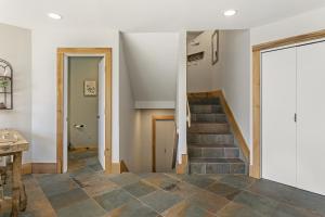 a staircase in a home with stone flooring at 770 Potato Patch townhouse in Vail