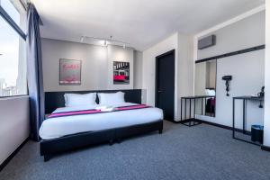 Postel nebo postele na pokoji v ubytování TEEDO Hotel Kuala Lumpur