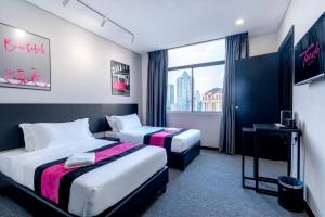 Postel nebo postele na pokoji v ubytování TEEDO Hotel Kuala Lumpur