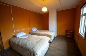 Postel nebo postele na pokoji v ubytování Guest House AKU'TSA