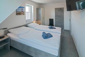 Postel nebo postele na pokoji v ubytování Ferienhaus Empora
