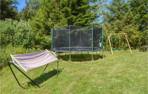 a tent and a swing set in a yard at Holiday Home Kuskevej Jerup X in Jerup +20 photos