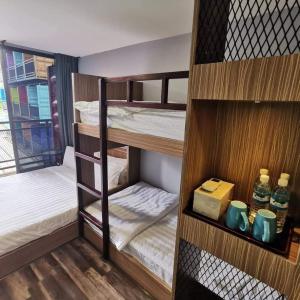 Postel nebo postele na pokoji v ubytování Boxinn The Kontena Home