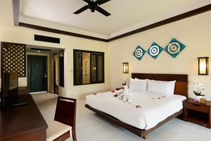 Postel nebo postele na pokoji v ubytování Nang Thong Bay Resort