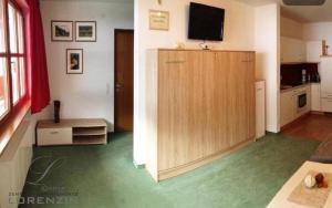 TV i/ili multimedijalni sistem u objektu Zentrum Appartements Lorenzin