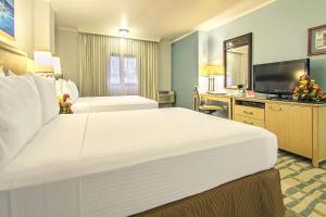Postel nebo postele na pokoji v ubytování Grand Hotel Guayaquil, Ascend Hotel Collection