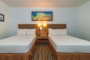 Postel nebo postele na pokoji v ubytování Grand Hotel Guayaquil, Ascend Hotel Collection