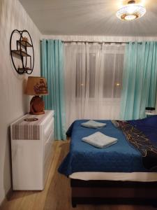 Ένα ή περισσότερα κρεβάτια σε δωμάτιο στο Apartament Muszelka 28