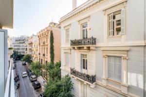 a view of a city street from a building at Alma Suite - close to Acropolis in Athens