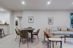 a living room with a couch and a table and chairs at Blueground Santa Clara 2bd apartment SFO-1771 in Milpitas