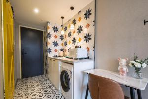 Kuchyň nebo kuchyňský kout v ubytování Suyi Hotel Apartment