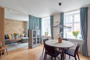 a living room with a table and a couch at Cherryy in Copenhagen