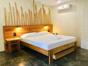 Postel nebo postele na pokoji v ubytování Terra Siargao