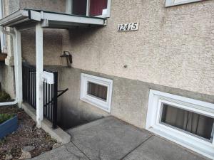 a building with two windows on the side of it at Chamber Inn in Edmonton