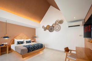 Ein Bett oder Betten in einem Zimmer der Unterkunft Aeera Villa Canggu by Ini Vie Hospitality