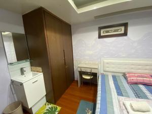 Letto o letti in una camera di 永春棧Kozzy Apartment
