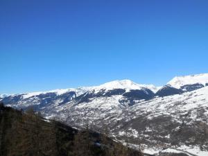 a snow covered mountain range with snow covered mountains at Résidence Le Sextant - SEXTANT 405 MAE-0551 in La Plagne Tarentaise +2 photos
